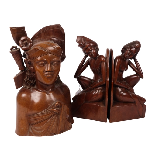 479 - A pair of carved Balinese bookends, and a Balinese hunter bust by Fatimah, Bali, all signed to base,... 