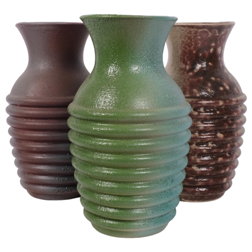 483 - A set of 3 Studio vases, an installation, the glaze colour changing from vase to vase, H24cm