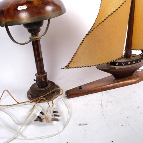 502 - A wooden sailing ship design table lamp (1 sail split), H55cm, and a tortoiseshell effect Vintage me... 