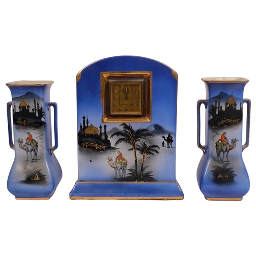 511 - A Staffordshire pottery 3-piece clock garniture, with design of camels and palm trees, circa 1920s, ... 