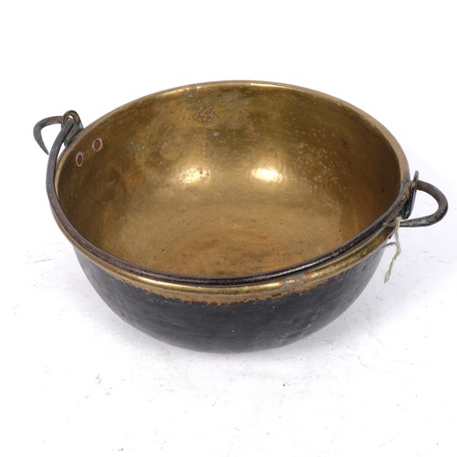 380 - A Victorian brass swing-handled pan