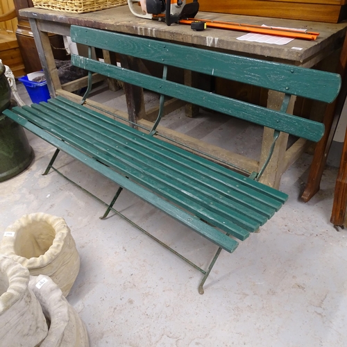 2695 - A painted folding garden bench on cast iron base. 158x80x60cm.