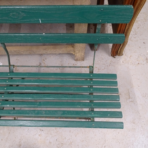 2695 - A painted folding garden bench on cast iron base. 158x80x60cm.