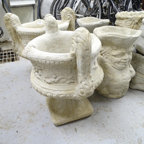 2697 - A pair of modern concrete two-section garden urns, 50x53x36cm, and pair of concrete planter/umbrella... 