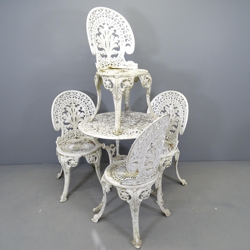 2699 - A painted circular garden table, 68x68cm, and four matching chairs.