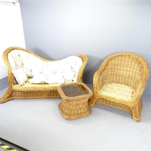 2702 - A modern wicker conservatory suite comprising a two seater sofa, matching armchair and coffee table ... 