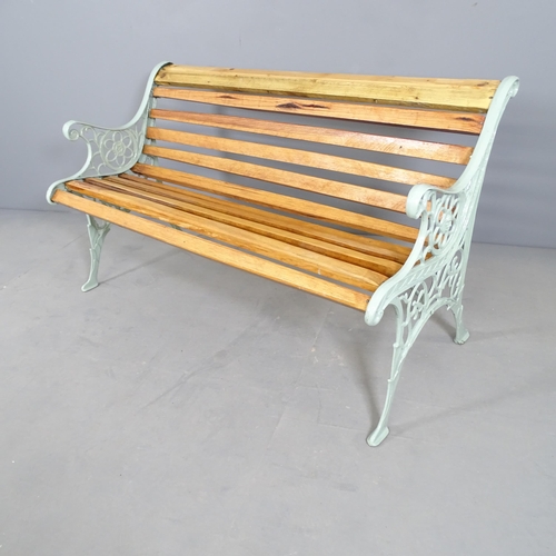 2708 - A pine slatted garden bench with painted cast iron ends. 124x71x56cm.