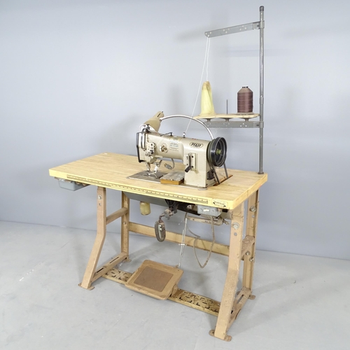 2724 - A Pfaff flat bed sewing machine on work table, dimensions (table) 122x75x51cm.
From the workshop of ... 