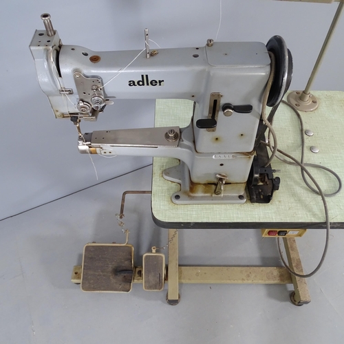 2725 - An Adler 69-362 cylinder arm sewing machine on work table.
From the workshop of saddle maker Brian R... 