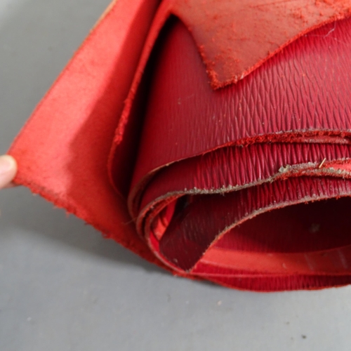 2734 - A roll containing two hides of Sedgewick's 3mm Bag Hide and plain leather in red.
From the workshop ... 