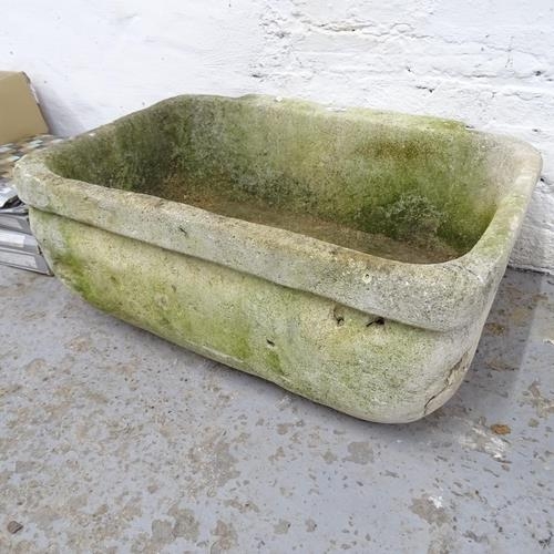 2750 - A weathered stone sink. 73x29x53cm.