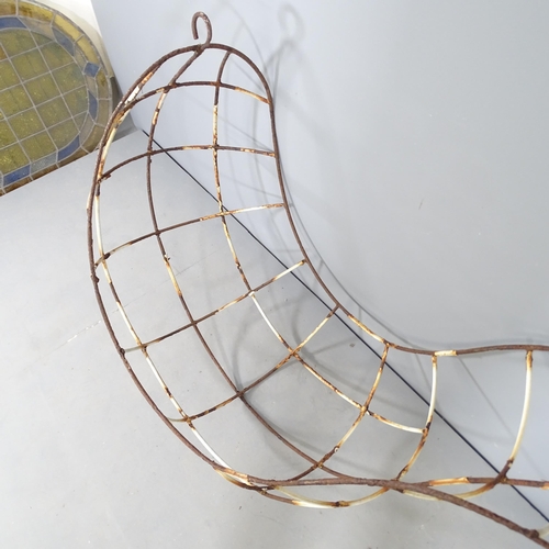 2755 - A wrought iron leaf chair or hanging planter. Overall 167x107x72cm.