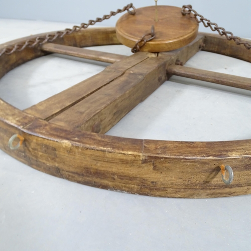 2757 - An oak circular hanging pan rack. Diameter 104cm.