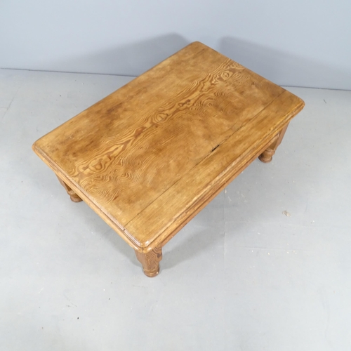 2758 - A waxed pitch pine low coffee table, with end frieze drawer. 94x40x63cm.