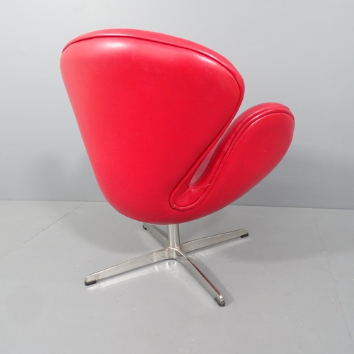 2030 - A mid-century style swivel lounge chair in the manner of the Arne Jacobsen Swan chair, upholstered i... 