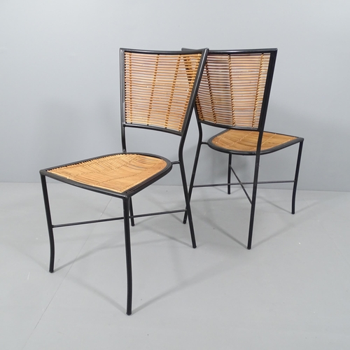 2044 - A set of four mid-century design chairs in black painted metal and bamboo.