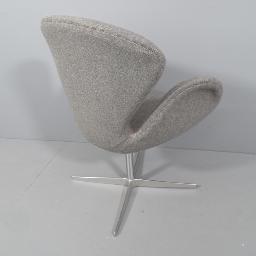 2045 - A mid-century style swivel lounge chair in the manner of the Arne Jacobsen Swan chair.