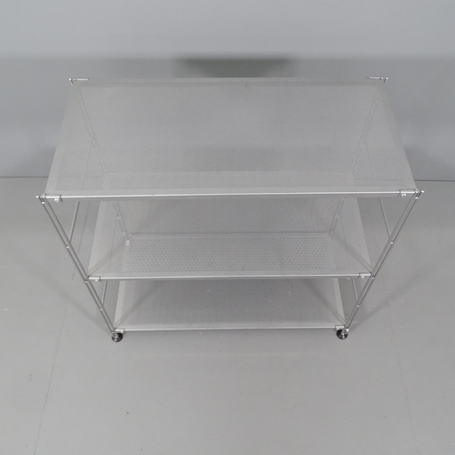 2047 - A contemporary designer three-tier shelving unit with perforated metal shelves on chrome steel base.... 