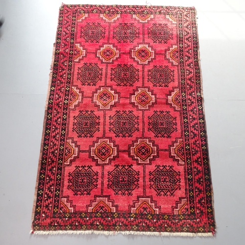 2300 - A red-ground Turkey rug. 177x110cm