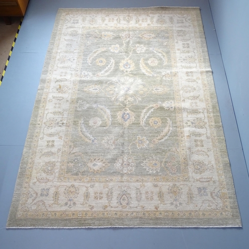 2303 - A cream-ground Ziglamahal carpet. 277x188cm.