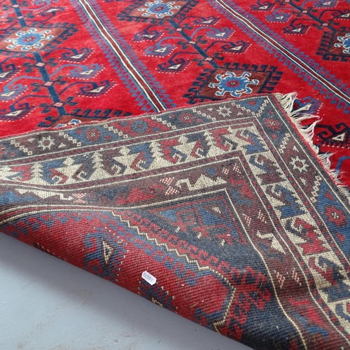 2308 - A red-ground Persian carpet. 293x198cm.