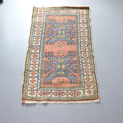 2321 - A small salmon-ground Afghan runner. 135x85cm.