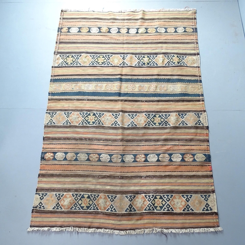 2323 - A Moroccan Kilim rug. 200x130cm.