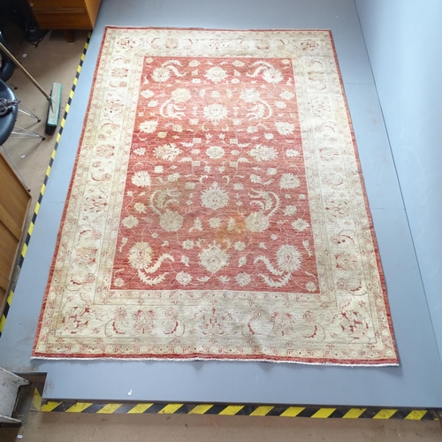 2324 - A cream-ground Afghan Ziegler carpet. 295x205xcm