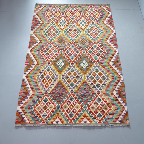 2327 - A Chobi Kilim rug. 205x130cm.