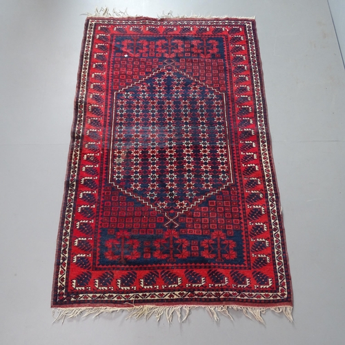 2330 - A red-ground Afghan rug. 183x115cm