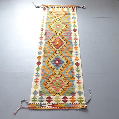 2334 - A Chobi Kilim runner. 210x64cm.