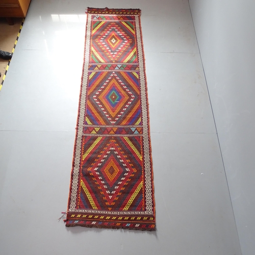 2335 - A Suzni Kilim runner. 310x78cm.