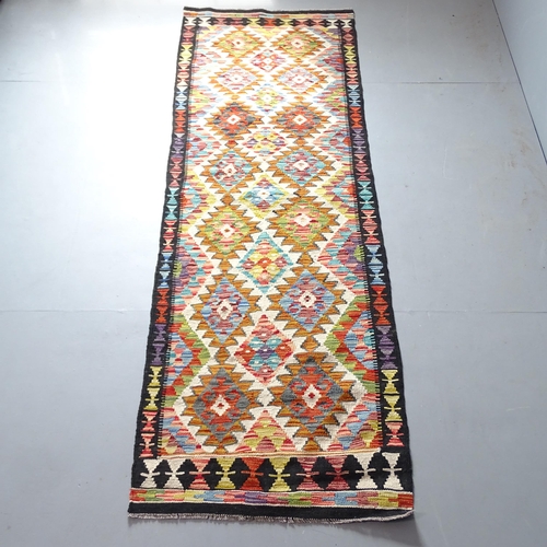 2337 - A Chobi Killim runner. 247x82cm.