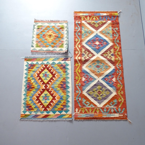 2339 - A Chobi Kilim runner. 150x60, a Chobi Kilim mat, 79x59cm, and another, 48x49cm. (3)