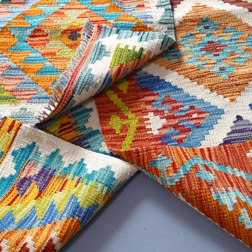 2339 - A Chobi Kilim runner. 150x60, a Chobi Kilim mat, 79x59cm, and another, 48x49cm. (3)