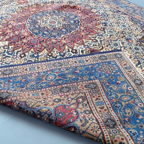 2343 - A blue-ground Mood carpet. 305x226cm