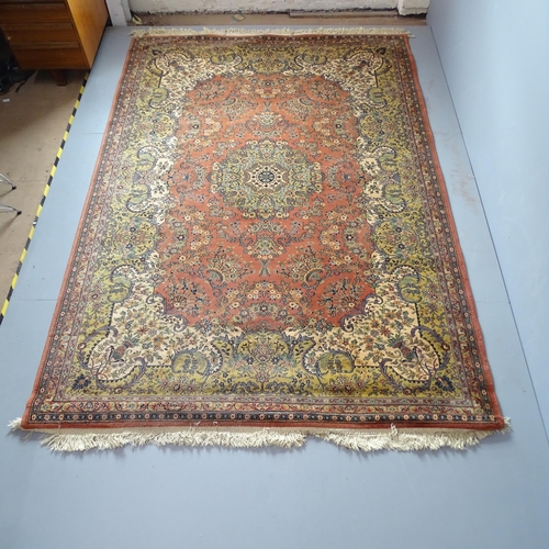 2344 - A salmon and cream-ground Persian style carpet. 290x202cm.