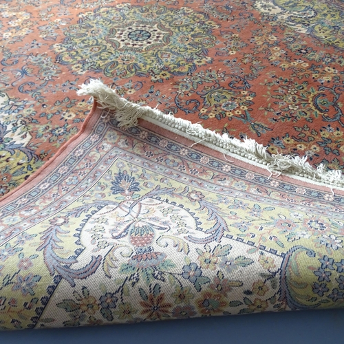 2344 - A salmon and cream-ground Persian style carpet. 290x202cm.