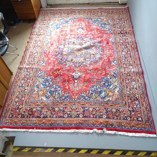 2346 - A red-ground Meshed carpet. 335x240cm