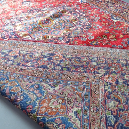 2346 - A red-ground Meshed carpet. 335x240cm