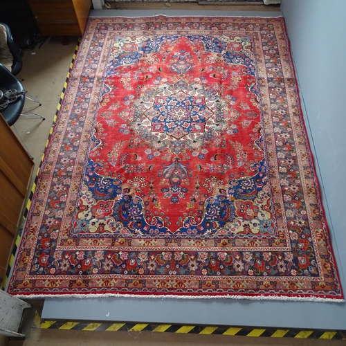 2347 - A red-ground Meshed carpet. 330x240cm.