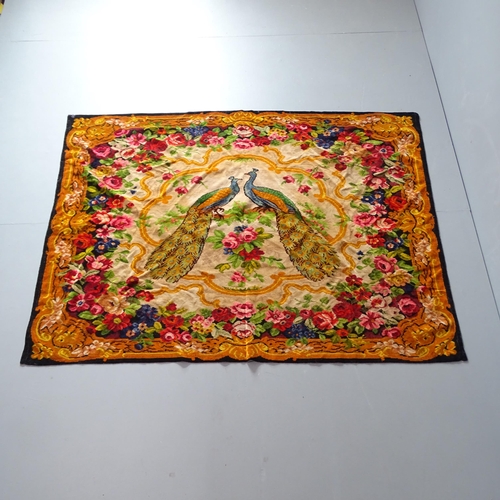 2358 - A machine made tapestry, with peacock and floral design. 181x132cm.