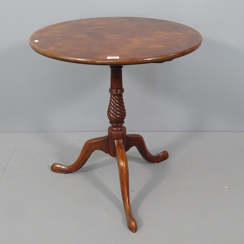 2296 - A mahogany circular topped occasional table, with spiral turned column and tripod base. 66x70cm.