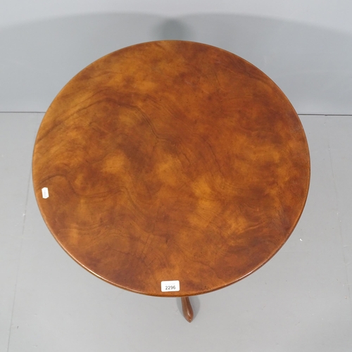 2296 - A mahogany circular topped occasional table, with spiral turned column and tripod base. 66x70cm.