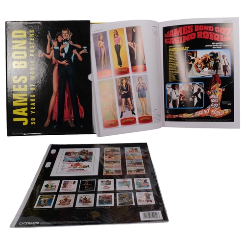 516 - A book of James Bond movie posters, and a set of reproduction lobby cards