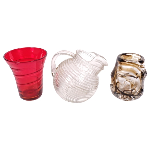 521 - A Whitefriars knobbley streaky vase, 13cm, a red glass vase, and a moulded jug