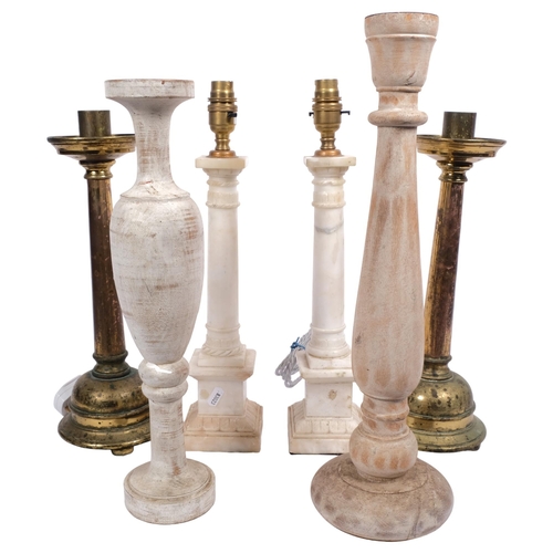 522 - A pair of alabaster table lamps, H41cm, a pair of brass candlesticks, and 2 turned and painted woode... 