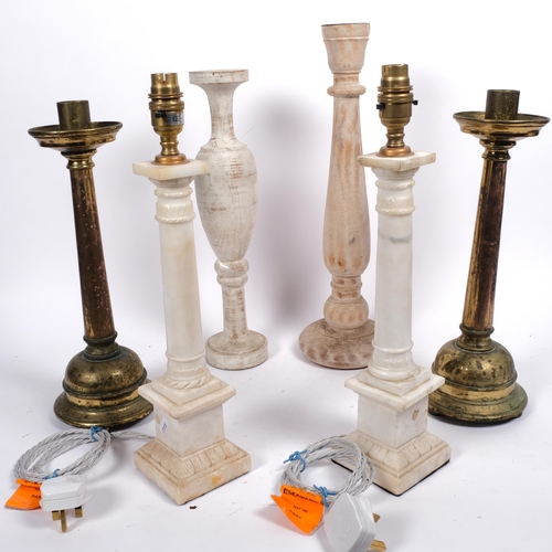 522 - A pair of alabaster table lamps, H41cm, a pair of brass candlesticks, and 2 turned and painted woode... 