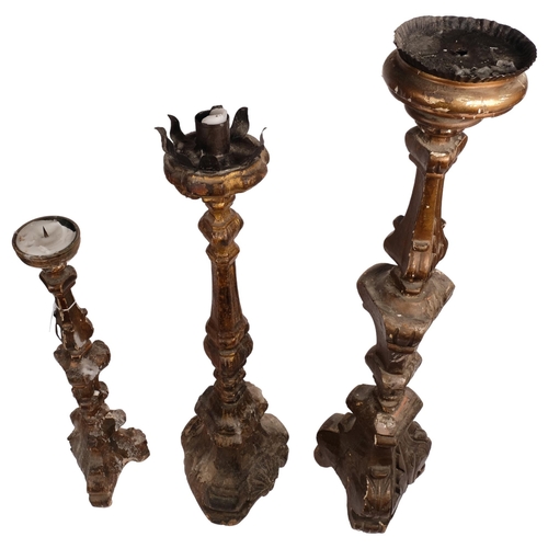 530 - A group of Antique Continental carved and painted wood pricket candlesticks, tallest 87cm