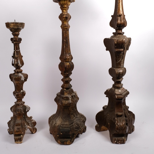 530 - A group of Antique Continental carved and painted wood pricket candlesticks, tallest 87cm